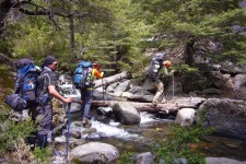 Crossing the river in the vegas de Los Troncos Vilches (Chile)