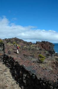 Walking on the black volcanic rock